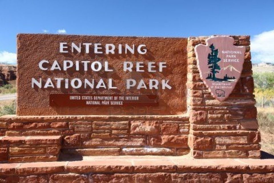 Capitol Reef National Park entrance sign with National Park Service emblem