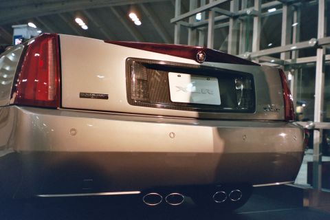 1992 Mercury Grand Marquis - The rear of a Cadillac XLR is shown, its distinctive taillights and exhaust system.