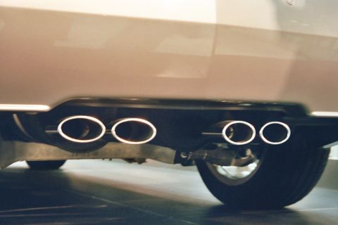 1992 Mercury Grand Marquis - Close-up of a car's rear bumper, highlighting its quad exhaust tips.