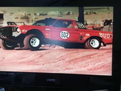 1964 Ford Ranchero - Modified 1964 Ford Ranchero race truck with large tires and number 602 visible.