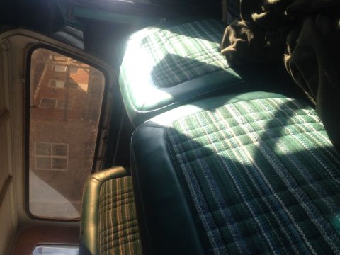 1979 Ford Bronco - Interior view of the green plaid seats inside a 1979 Ford Bronco.