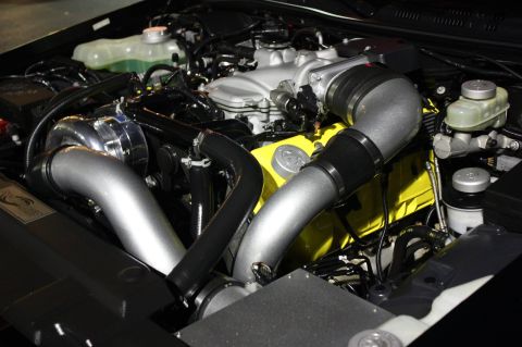2003 Mercury Marauder - Engine bay features a custom turbocharger setup with prominent silver intake piping and yellow engine accents.