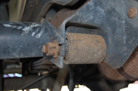 1994 Ford Bronco - Underside view of a worn suspension bushing, showing rust and wear on the metal components.