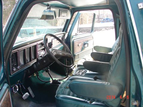 1978 Ford Bronco - Interior view of a 1978 Ford Bronco, teal upholstery and dashboard details.