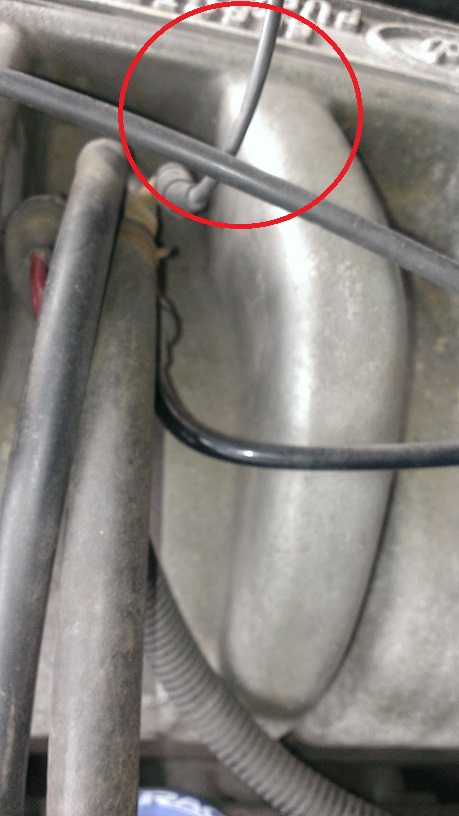 1988 Ford Bronco - Engine component detail with wires and hoses visible, a red circle marks a specific area.