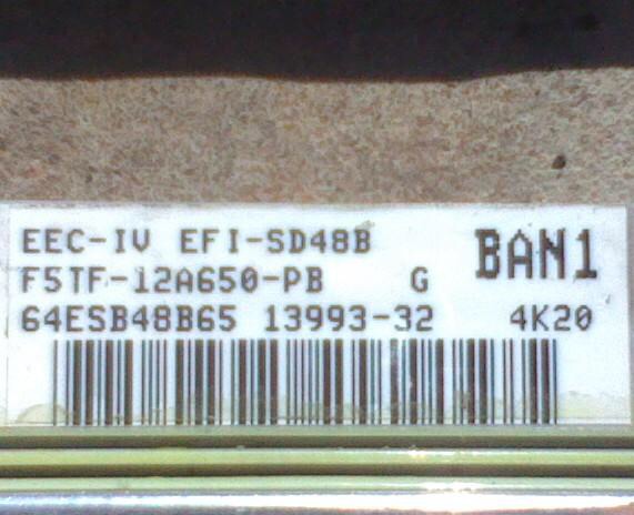 Label on a vehicle computer module with text EEC-IV EFI-SD48B, F5TF-12A650-PB, 64ESB48B65 13993-32, BAN1, and 4K20