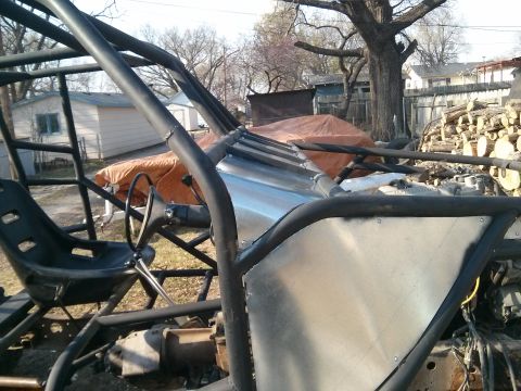 1986 Ford Bronco - This is a custom-built buggy chassis with a roll cage and a single bucket seat visible.