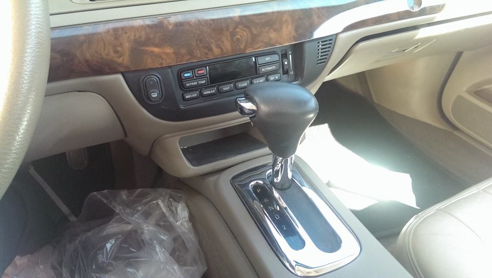 Interior view of a 2000 Mercury Grand Marquis showing the center console and gear shifter