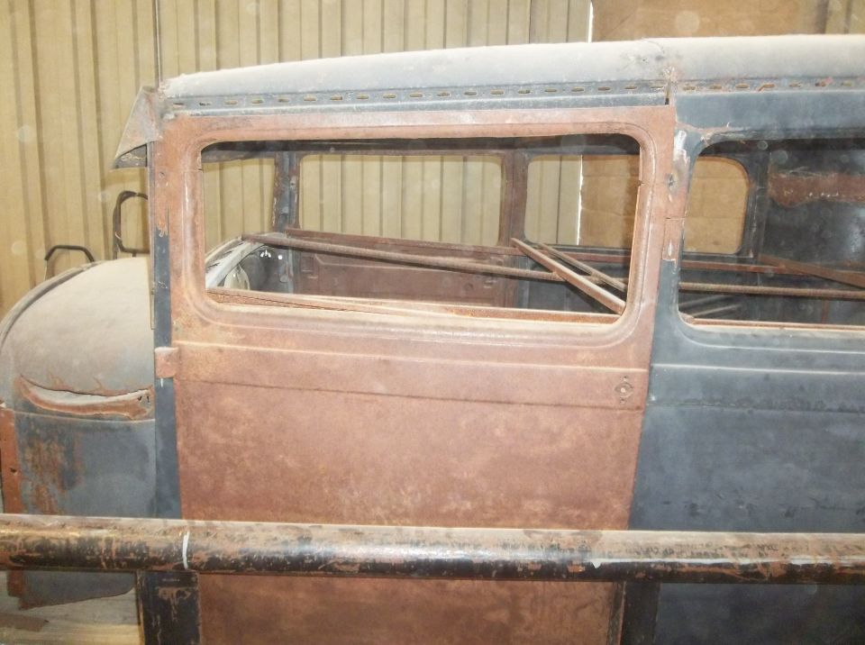 1929 Ford Sedan door and window frame, showing rust and missing glass