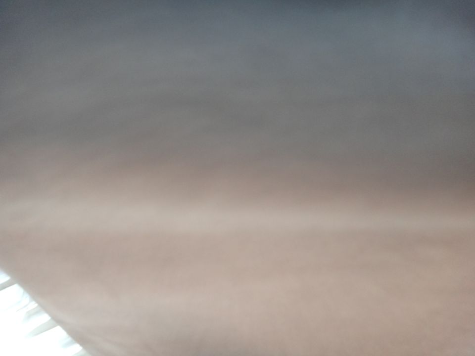 blurry abstract background with gradient from dark gray to light brown