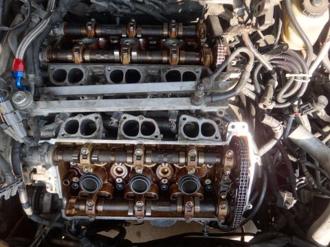 1993 Ford Taurus - Close-up view of an engine's internal components, including camshafts and timing chain.