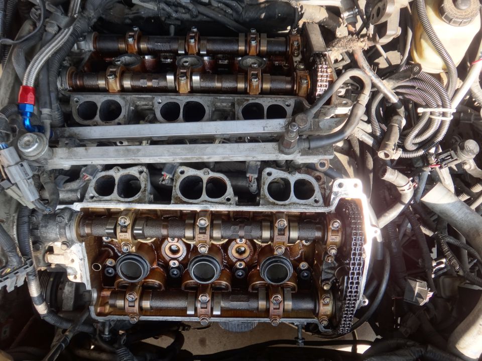 Engine with exposed camshafts and timing chain