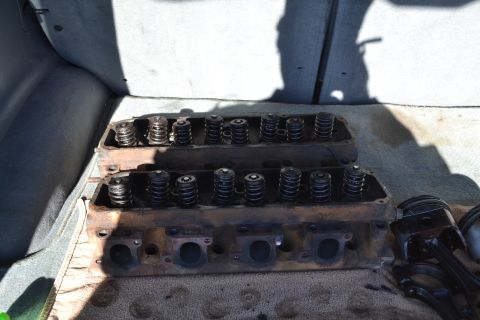 1981 Ford F-250 - Engine cylinder heads and pistons are shown inside a vehicle, suggesting a repair or transport scenario.