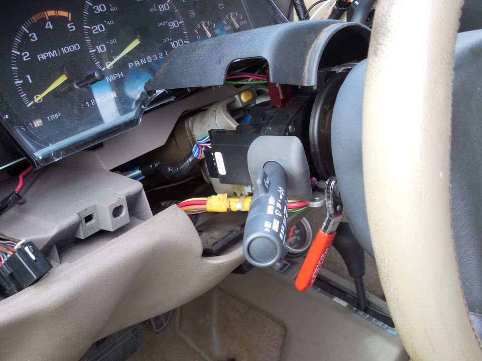 The new switch went right back in, and I reconnected it for testing before finishing the installation up here.  It worked fine, so I put the rest of the dash back together.  The pick was used to lift the steering wheel lip over the upper shroud lip.