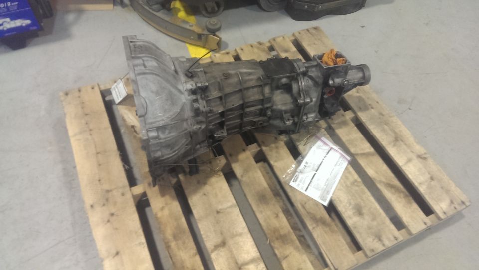 transmission on a wooden pallet, with a paper tag attached