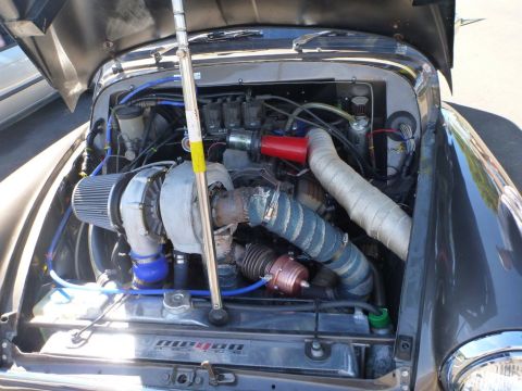 1964 Mercury Monterey - The engine bay features a large turbocharger and extensive custom modifications, with a visible Mopar logo.