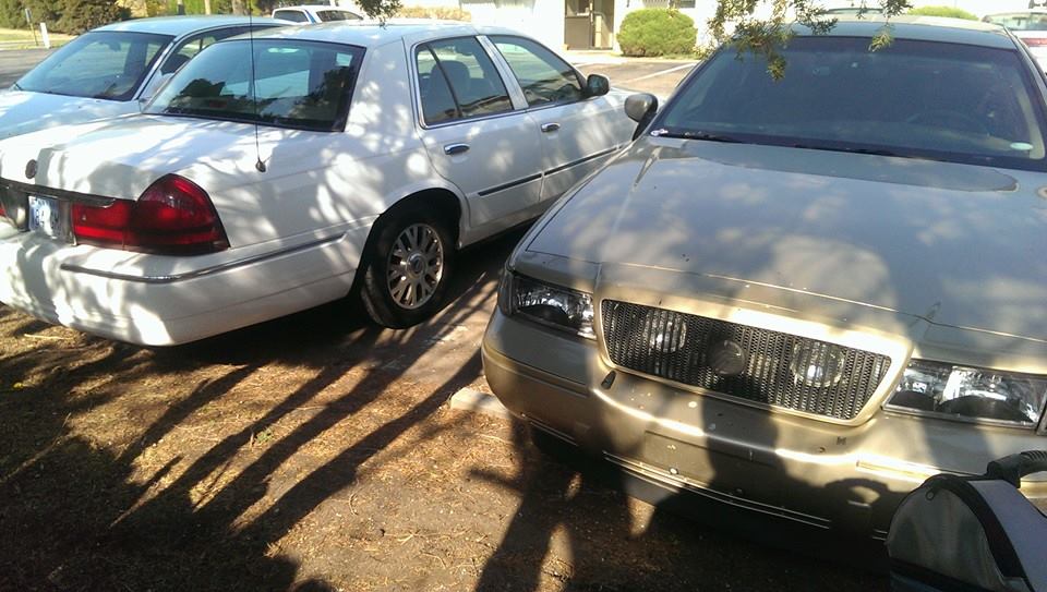 Gold 2000 Mercury Grand Marquis front end with chrome grille