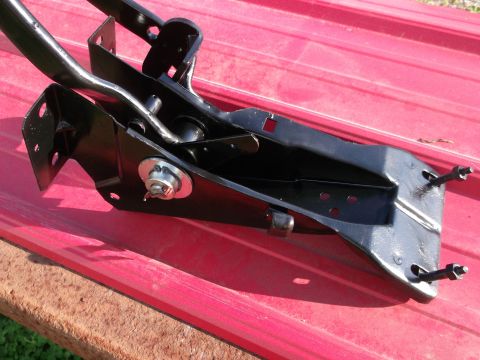 1967 Ford Mustang - A close-up view of a vehicle's clutch pedal assembly, showing its mechanical components.