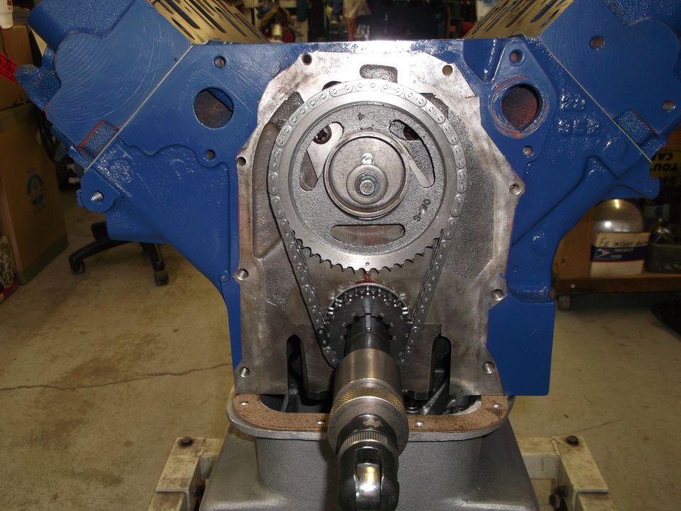 Close-up of engine block with timing chain and gears exposed