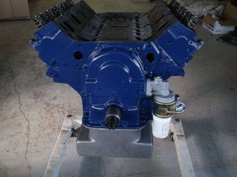 1967 Ford Mustang - A blue V8 engine assembly, including the oil pan and fuel pump, is shown from the side.