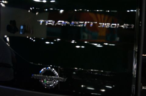 1993 Ford Taurus - Close-up of a TRANSIT 350HD badge on a dark vehicle.
