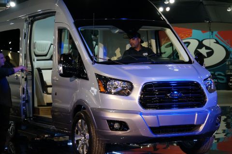 1993 Ford Taurus - Silver Ford Transit van shown with its passenger door open and a person in the driver's seat.