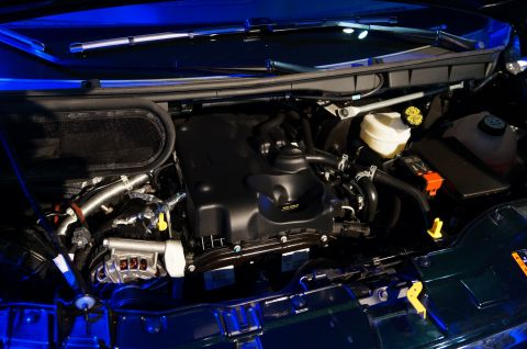 1993 Ford Taurus - Close-up view of a vehicle's engine bay, showing various components and wiring.