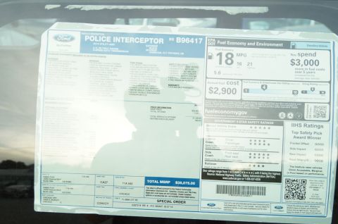 1993 Ford Taurus - A window sticker for a Ford Police Interceptor details its price, fuel economy, and safety ratings.