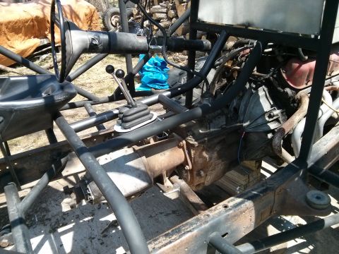 1986 Ford Bronco - Chassis of a custom off-road vehicle, the transmission and steering components.