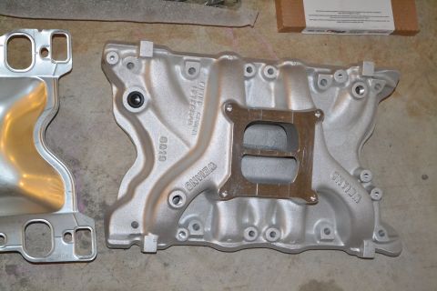 1981 Ford F-250 - Two aluminum intake manifolds are shown, one with the WEIAND brand visible.