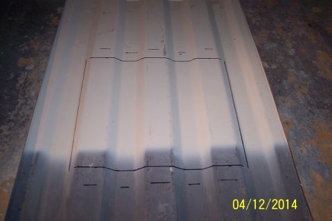 1990 Ford Bronco - Metal panel with cut lines drawn, likely for a floor access panel modification.