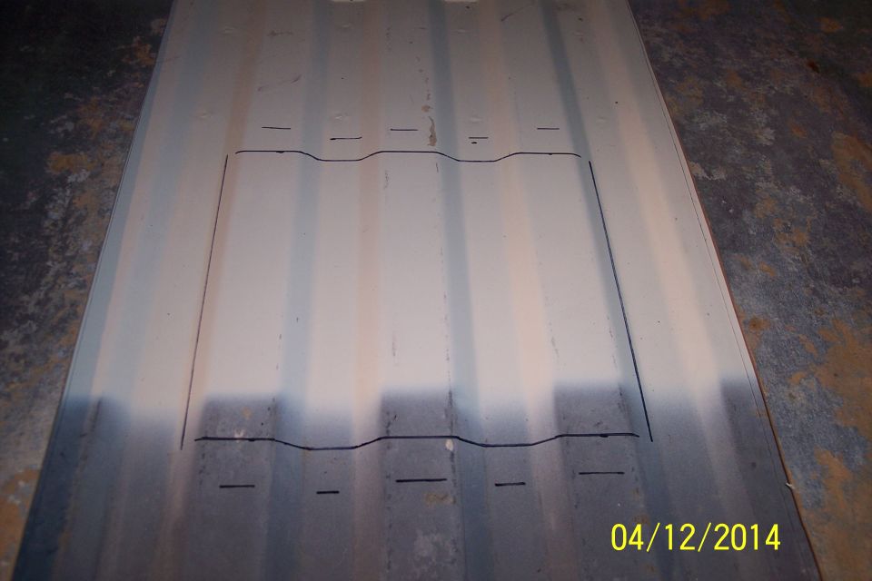 Metal panel with cut lines drawn on it, possibly for a floor access panel