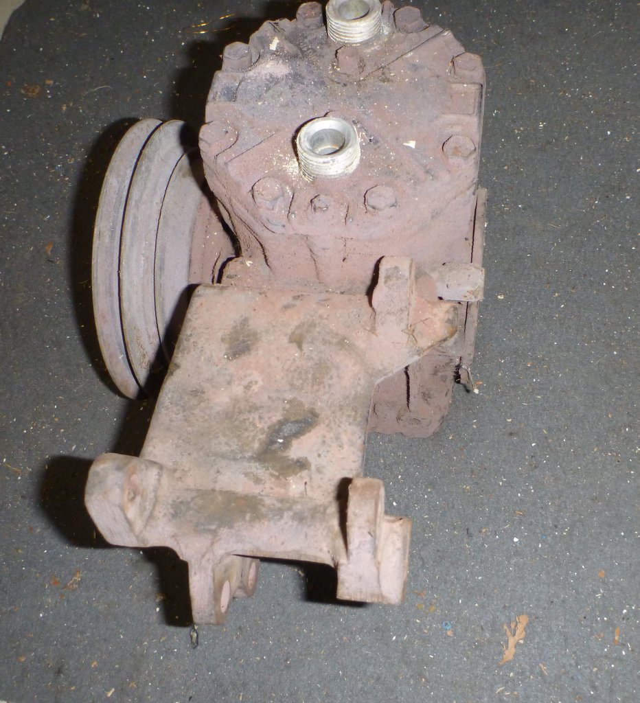 rusty air conditioning compressor with pulley