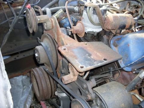 1964 Mercury Monterey - Close-up view of engine pulleys and belts, showing signs of rust and wear.
