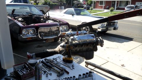 1972 Ford Ranchero - Engine removal in progress for a 1972 Ford Ranchero, with a second Ranchero visible.