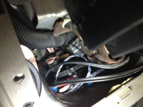 2005 Jeep Wrangler - This photo shows the complex wiring and conduit system located within the interior of a vehicle.