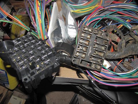 1978 Ford Bronco - Close-up of automotive wiring harness and fuse boxes, not a 1978 Ford Bronco.