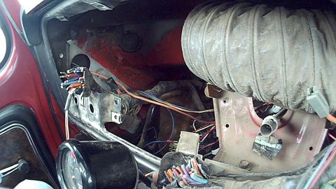 1978 Ford Bronco - The dashboard's internal wiring and ventilation system are visible in this close-up view.
