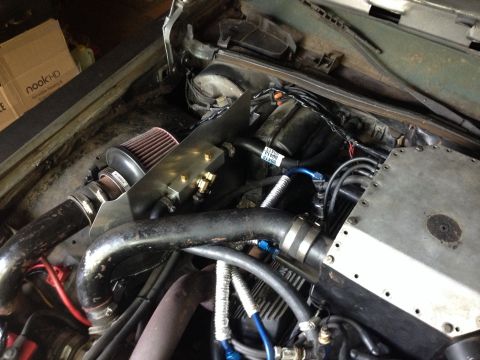 1981 Ford LTD - Manifold installed. Had to make a heat shield for the air intake so I mounted the manifold to it. The low temp switch is toward the firewal…