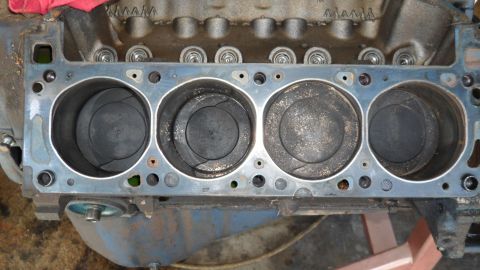 1972 Ford Ranchero - Close-up view of an engine block's cylinders and pistons, showing wear and carbon deposits.