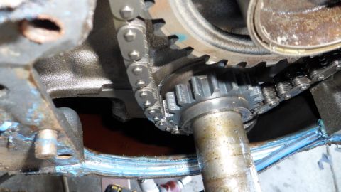 1972 Ford Ranchero - Engine timing chain and gears are visible, with blue sealant applied to the engine block.