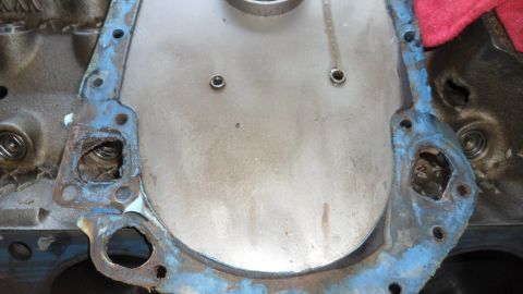 1972 Ford Ranchero - Timing cover gasket removed from engine block, revealing internal components.