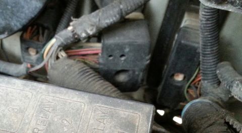 1995 Ford Bronco - Engine compartment wiring and fuse box detail, showing relays and connectors.