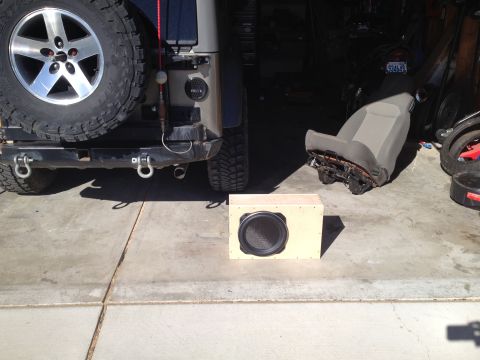 2005 Jeep Wrangler - A Jeep Wrangler's rear is shown with a subwoofer box and a removed seat, suggesting interior work.