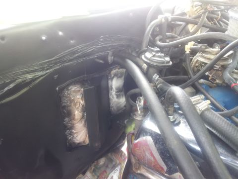 1976 Ford Ranchero - Close-up view of engine bay components and firewall insulation.