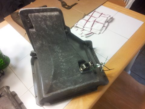 1976 Ford Ranchero - This is a part of an air conditioning duct housing, likely from a vehicle, shown on a table.