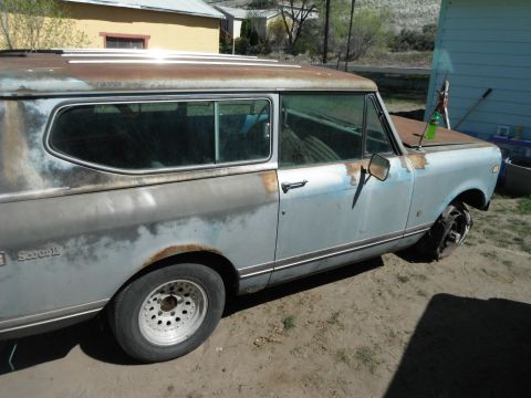 1972 International Scout II - This weathered International Scout II sits outdoors, showing signs of rust and a flat front tire.
