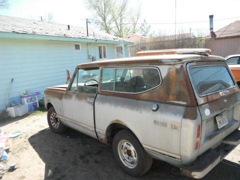 1972 International Scout II - This 1972 International Scout II has significant rust and appears to be in a yard.