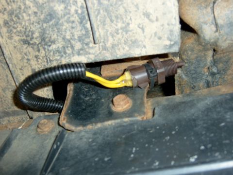 1995 Ford Bronco - I decided to mount it on the right side near where the bumper is attached to the frame; I just used a zip tie to hole it in place.
