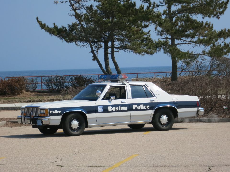 Boston Police Ford LTD Crown Victoria, driver-side profile overlooking the ocean